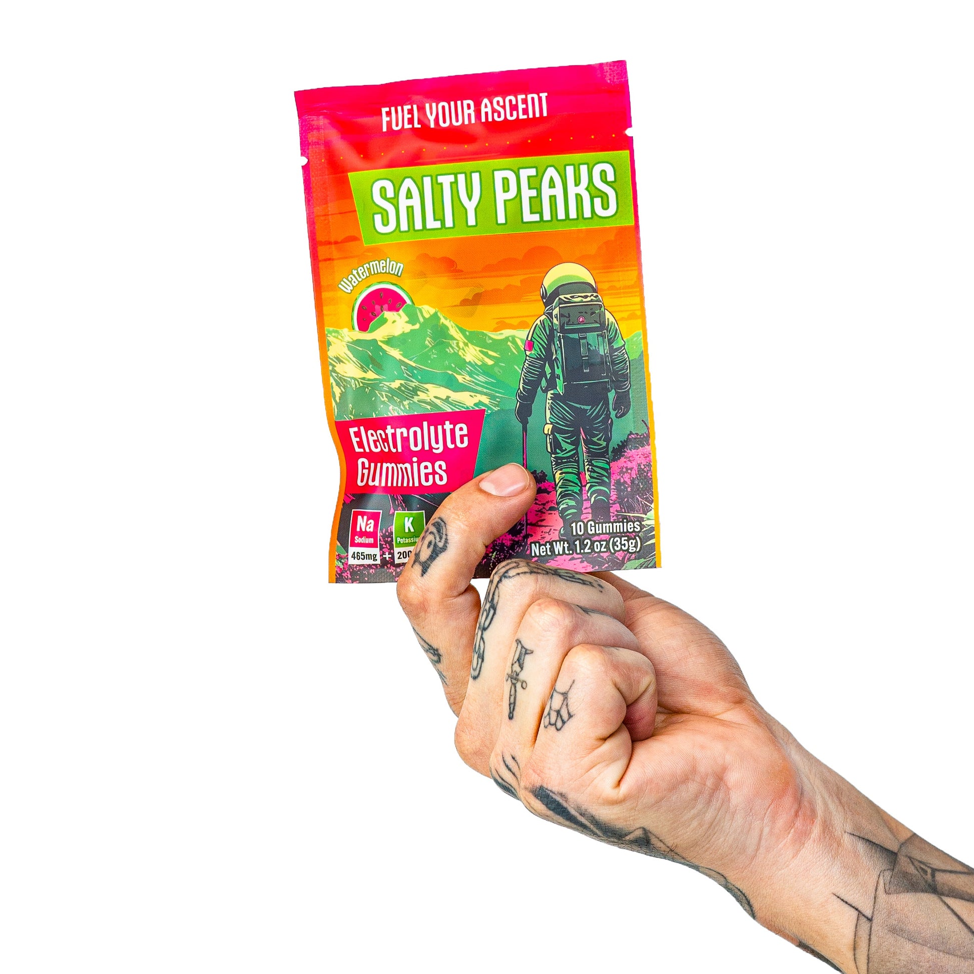 Hand holding Salty Peaks single-serve electrolyte gummies packet